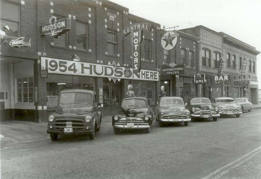 CDA-20-001  Coeur d'Alene  Automotive Dealers; Central Motors Central Motors automotive display on Sherman Ave. "1954 Hudsons are here" Located between 3rd &amp; 2nd south side.   2/1954  Walker, Kyle